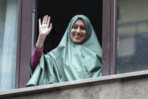 Silvia Romano smiles from a window after she arrived at her home, in Milan, Italy, 11 May 2020. The young Italian woman has returned to her homeland after 18 months as a hostage in eastern Africa.  ANSA/Marco Ottico