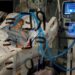 A coronavirus disease (COVID-19) patient lies intubated in their isolation room on the Intensive Care Unit (ICU) at Western Reserve Hospital in Cuyahoga Falls, Ohio, U.S., January 4, 2022. REUTERS/Shannon Stapleton REFILE - CORRECTING ACTION - RC2MSR9TZQUK