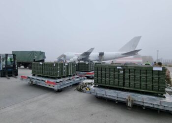 Workers and Ukrainian servicemen unload a shipment of ammunition delivered as part of the United States of America's security assistance to Ukraine, at the Boryspil International Airport outside Kyiv, Ukraine November 14, 2021. Picture taken November 14, 2021. Press service of the U.S. Embassy in Ukraine/Handout via REUTERS  ATTENTION EDITORS - THIS IMAGE WAS PROVIDED BY A THIRD PARTY.