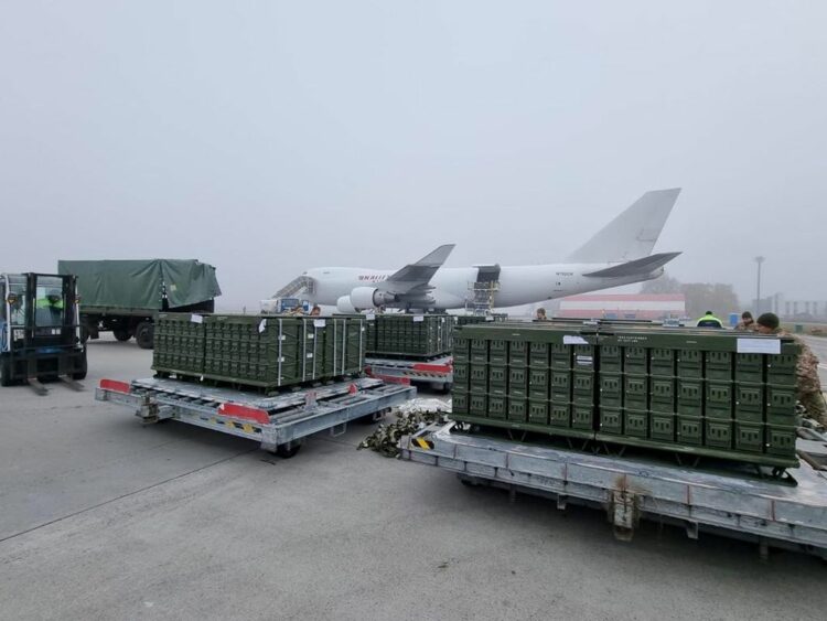 Workers and Ukrainian servicemen unload a shipment of ammunition delivered as part of the United States of America's security assistance to Ukraine, at the Boryspil International Airport outside Kyiv, Ukraine November 14, 2021. Picture taken November 14, 2021. Press service of the U.S. Embassy in Ukraine/Handout via REUTERS  ATTENTION EDITORS - THIS IMAGE WAS PROVIDED BY A THIRD PARTY.