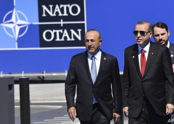 Turkish President Recep Tayyip Erdogan, right, and Foreign Minister Mevlut Cavusoglu arrive for the NATO summit in Brussels on Thursday, May 25, 2017. US President Donald Trump and other NATO heads of state and government on Thursday will inaugurate the new headquarters as well as participating in an official working dinner. (AP Photo/Geert Vanden Wijngaert)