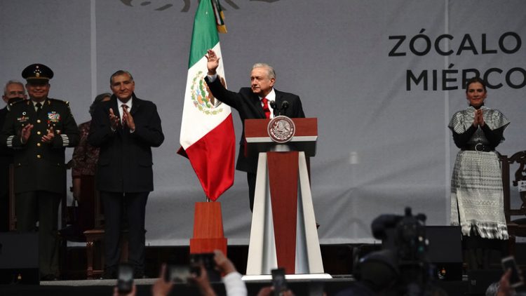 Mexican President Andres Manuel Lopez Obrador greets the crowd at a rally to commemorate his third anniversary in office, in the main square of the capital, the Zocalo, in Mexico City, Wednesday, Dec. 1, 2021. (Photo AP/Marco Ugarte)