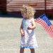 Miss Hoskins displays her American flag prior to the arrival of her father Master Sergeant (MSGT) Hoskins at March Air Reserve Base (ARB), California (CA) as she waits to welcome him home from a deployment in support of Operation IRAQI FREEDOM.