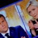 A picture of a tv screen shows the French presidential election debate between French President Emmanuel Macron, candidate for his re-election, and French far-right National Rally (Rassemblement National) party candidate Marine Le Pen, in Paris, France,  April 20, 2022. REUTERS/Christian Hartmann