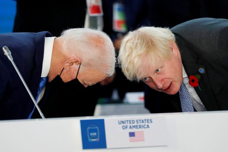 U.S. President Joe Biden and Britain's Prime Minister Boris Johnson arrive for a roundtable meeting during the G20 summit in Rome, Italy, October 30, 2021. REUTERS/Remo Casilli - RC29KQ95D3F1