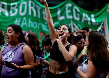 In this April 10, 2018 photo, women attend a pro-abortion demonstration to demand its legalization in Buenos Aires, Argentina. A bill allowing the procedure in the first 14 weeks of pregnancy was introduced into Congress earlier this year with the backing of 70 lawmakers from across the political spectrum. The bill needs 129 votes in the 257-seat lower house to pass and then it goes to the senate. (AP Photo/Natacha Pisarenko)
