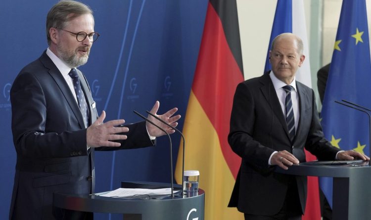 German Chancellor Olaf Scholz, right, and the Prime Minister of the Czech Republic, Petr Fiala, left, address the media during a press conference as part of a meeting at the chancellery in Berlin, Germany, Thursday, May 5, 2022. (AP Photo/Michael Sohn)