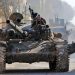 Turkey-backed Syrian fighters ride a tank in the town of Saraqib in the eastern part of the Idlib province in northwestern Syria, on February 27, 2020. - Syrian rebels reentered the key northwestern crossroads town of Saraqib lost to government forces earlier this month but fierce fighting raged on in its outskirts today, an AFP correspondent reported. (Photo by Bakr ALKASEM / AFP) (Photo by BAKR ALKASEM/AFP via Getty Images)