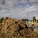 A man clears debris on a slip road of the A12 highway during a farmers' demonstration against the government's nitrogen policy, near Bunnik on July 27, 2022. - Netherlands OUT (Photo by Sem van der Wal / ANP / AFP) / Netherlands OUT (Photo by SEM VAN DER WAL/ANP/AFP via Getty Images)