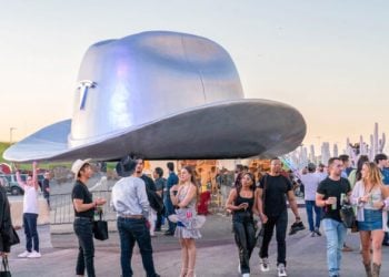 A giant cowboy hat is on display outside the Tesla Giga Texas manufacturing facility during the "Cyber Rodeo" grand opening party on April 7, 2022 in Austin, Texas. - Tesla welcomed throngs of  electric car lovers to Texas on April 7 for a huge party inaugurating a "gigafactory" the size of 100 professional soccer fields. (Photo by SUZANNE CORDEIRO / AFP) (Photo by SUZANNE CORDEIRO/AFP via Getty Images)