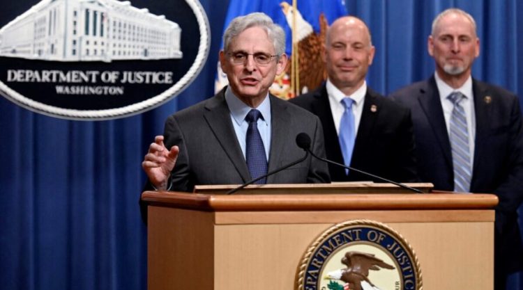 US Attorney General Merrick B. Garland, alongside US Attorney Mark Wildasin (2R), for the Middle District of Tennessee, and ATF Special Agent in Charge Mickey French of the Nashville Field Division (R), speaks about a significant firearms trafficking enforcement action during a news conference at the Justice Department in Washington, DC, on April 1, 2022. (Photo by Olivier DOULIERY / AFP) (Photo by OLIVIER DOULIERY/AFP via Getty Images)
