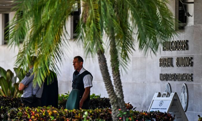 Security officers guard the entrance to the Paul G. Rogers Federal Building & Courthouse as the court holds a hearing to determine if the affidavit used by the FBI as justification for last week's search of Trump's Mar-a-Lago estate should be unsealed, at the US District Courthouse for the Southern District of Florida in West Palm Beach, Florida on August 18, 2022. - FBI agents recovered multiple highly classified records during the search of former US President's estate, according to documents made public during a probe that includes possible violations of the US Espionage Act. (Photo by CHANDAN KHANNA / AFP) (Photo by CHANDAN KHANNA/AFP via Getty Images)