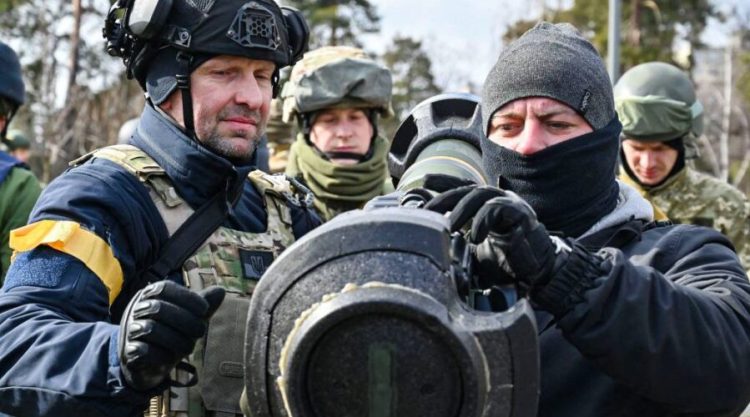 Members of the Ukrainian Territorial Defence Forces examine new armament, including NLAW anti-tank systems and other portable anti-tank grenade launchers, in Kyiv on March 9, 2022, amid the ongoing Russia's invasion of Ukraine. (Photo by GENYA SAVILOV / AFP) (Photo by GENYA SAVILOV/AFP via Getty Images)