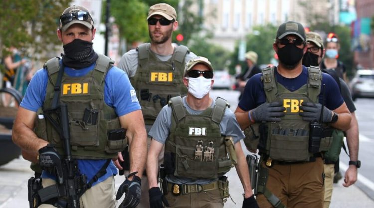 WASHINGTON, DC - JUNE 03: Members of the FBI carry weapons as protests continue against police brutality and the death of George Floyd, on June 3, 2020 in Washington, DC. Protests in cities throughout the country have been been held after the death of George Floyd, a black man who was killed in police custody in Minneapolis on May 25.  (Photo by Tasos Katopodis/Getty Images)