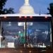 Migrants, who boarded a bus in Texas, are dropped off within view of the US Capitol building in Washington, DC, on August 11, 2022. - Since April, Texas Governor Greg Abbott has ordered buses to carry thousands of migrants from Texas to Washington, DC, and New York City to highlight criticisms of US President Joe Bidens border policy. (Photo by Stefani Reynolds / AFP) (Photo by STEFANI REYNOLDS/AFP via Getty Images)