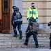 Police commandos enter a building at the scene of a reported incident at the Latin School in Malmo, Sweden on March 21, 2022 which left several people wounded. - Sweden OUT / ALTERNATIVE CROP (Photo by Johan NILSSON / various sources / AFP) / Sweden OUT / ALTERNATIVE CROP (Photo by JOHAN NILSSON/TT News Agency/AFP via Getty Images)