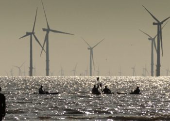 LIVERPOOL, UNITED KINGDOM - AUGUST 04: Kayakers paddle on the Mersey Estuary near the Burbo Bank Offshore Wind Farm on August 04, 2021 in Liverpool, United Kingdom. (Photo by Christopher Furlong/Getty Images)