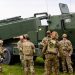 Military personnel stands in front of a High Mobility Artillery Rocket Systems (HIMARS) during the military exercise Namejs 2022 on September 26, 2022 in Skede, Latvia. (Photo by Gints Ivuskans / AFP) (Photo by GINTS IVUSKANS/AFP via Getty Images)