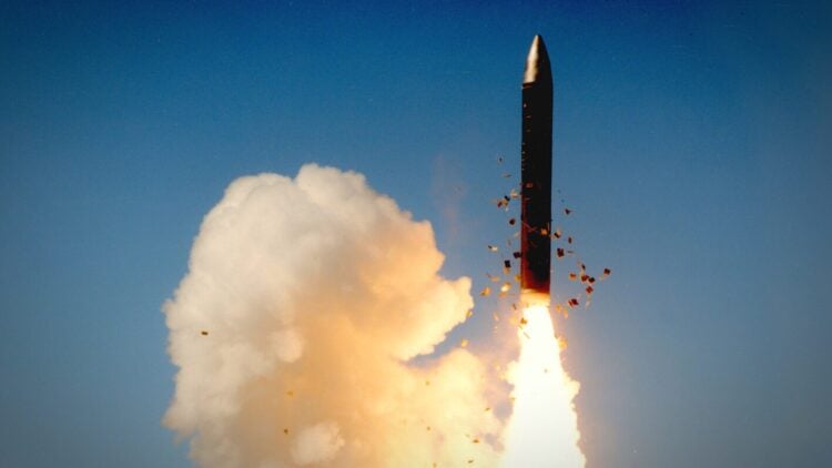 The LGM-118A’s first stage solid rocket ignites as the missile clears the silo. (U.S. Air Force photo)