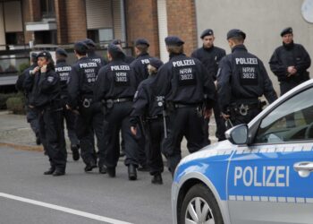 Police patrol  in Alsdorf, near Aachen, western Germany, Tuesday, Nov. 17, 2015. German police have arrested three people in Alsdorf near Aachen in connection with the Paris attacks, the dpa news agency reported Tuesday.  (AP Photo/Hermann J. Knippertz)