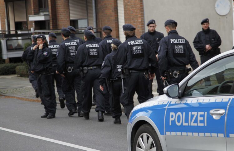 Police patrol  in Alsdorf, near Aachen, western Germany, Tuesday, Nov. 17, 2015. German police have arrested three people in Alsdorf near Aachen in connection with the Paris attacks, the dpa news agency reported Tuesday.  (AP Photo/Hermann J. Knippertz)