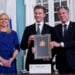 Secretary of State Antony Blinken, right, and Finland's Defense Minister Antti Häkkänen, center, pose for a photo after signing a Defense Cooperation Agreement as Finland's Foreign Minister Elina Valtonen joins at left at the State Department in Washington, Monday, Dec. 18, 2023. (AP Photo/Susan Walsh)