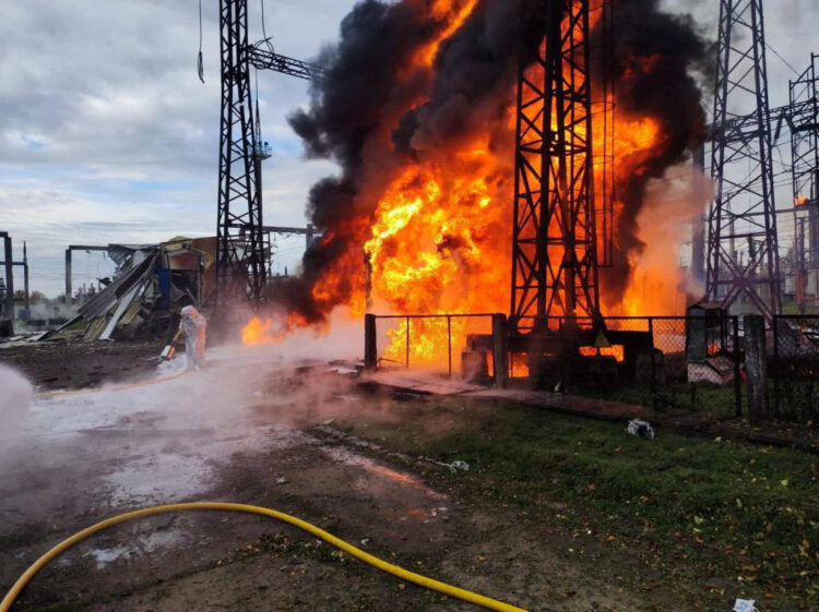 Firefighters work to put out a fire at energy infrastructure facilities, damaged by a Russian missile strike, as Russia's attack on Ukraine continues, in an undisclosed location, Ukraine October 22, 2022.  Ukrainian Presidential Press Service/Handout via REUTERS ATTENTION EDITORS - THIS IMAGE HAS BEEN SUPPLIED BY A THIRD PARTY.