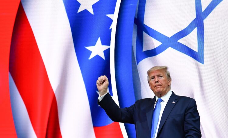 US President Donald Trump stands on stage after his address to the Israeli American Council National Summit 2019 at the Diplomat Beach Resort in Hollywood, Florida on December 7, 2019. (Photo by MANDEL NGAN / AFP) / ALTERNATE CROP (Photo by MANDEL NGAN/AFP via Getty Images)