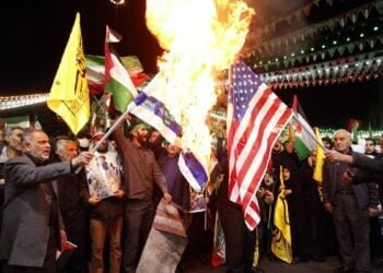 Iranians burn Israel and US flags during an anti-Israeli demonstration at Palestine Square in Tehran, Iran, 01 April 2024. According to  IRNA News Agency, Israel on 01 April launched an airstrike targeting the Iranian consulate building in Damascus. The embassy was damaged while the building annexed to it was destroyed. Seven Iranians have been killed including two top commander of Iranian revolutionary guard corps (IRGC).,Image: 861627727, License: Rights-managed, Restrictions: , Model Release: no