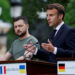 FILE PHOTO: French President Emmanuel Macron speaks as Ukrainian President Volodymyr Zelenskiy listens during a joint news conference, as Russia's attack on Ukraine continues, in Kyiv, Ukraine June 16, 2022.  REUTERS/Valentyn Ogirenko/File Photo