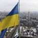 FILE - A Ukrainian national flag waves over the center of Kharkiv, Ukraine's second-largest city, Feb. 16, 2022.  U.S. officials say Ukraine for the first time has begun using long-range ballistic missiles, striking a Russian military airfield in Crimea and Russian troops in another occupied area overnight.  (AP Photo/Mstyslav Chernov, File)