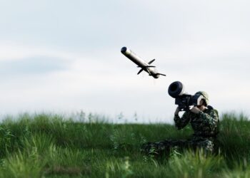 Soldier firing anti-tank missile at war from his lightweight portable weapon system