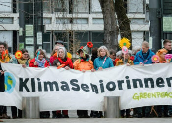 Strasbourg, France - Mar 29, 2023: A group of Swiss seniors protesting in front of European Court of Human Rights against their government which is not acting quickly enough on climate change