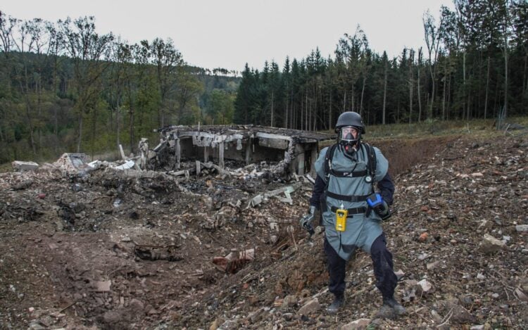 A handout photo provided on 11 December 2014 by the Police of the Czech Republic shows a pyrotechnician inspecting damaged private ammunition depots near Vrbetice, eastern Moravia, Czech Republic, 20 October 2014. The Czech authorities are investigating explosions at the depot which occurred on October 16 and December 03 in eastern Moravia., Image: 234272723, License: Rights-managed, Restrictions: HANDOUT EDITORIAL USE ONLY, Model Release: no, Credit line: Profimedia, TEMP EPA
